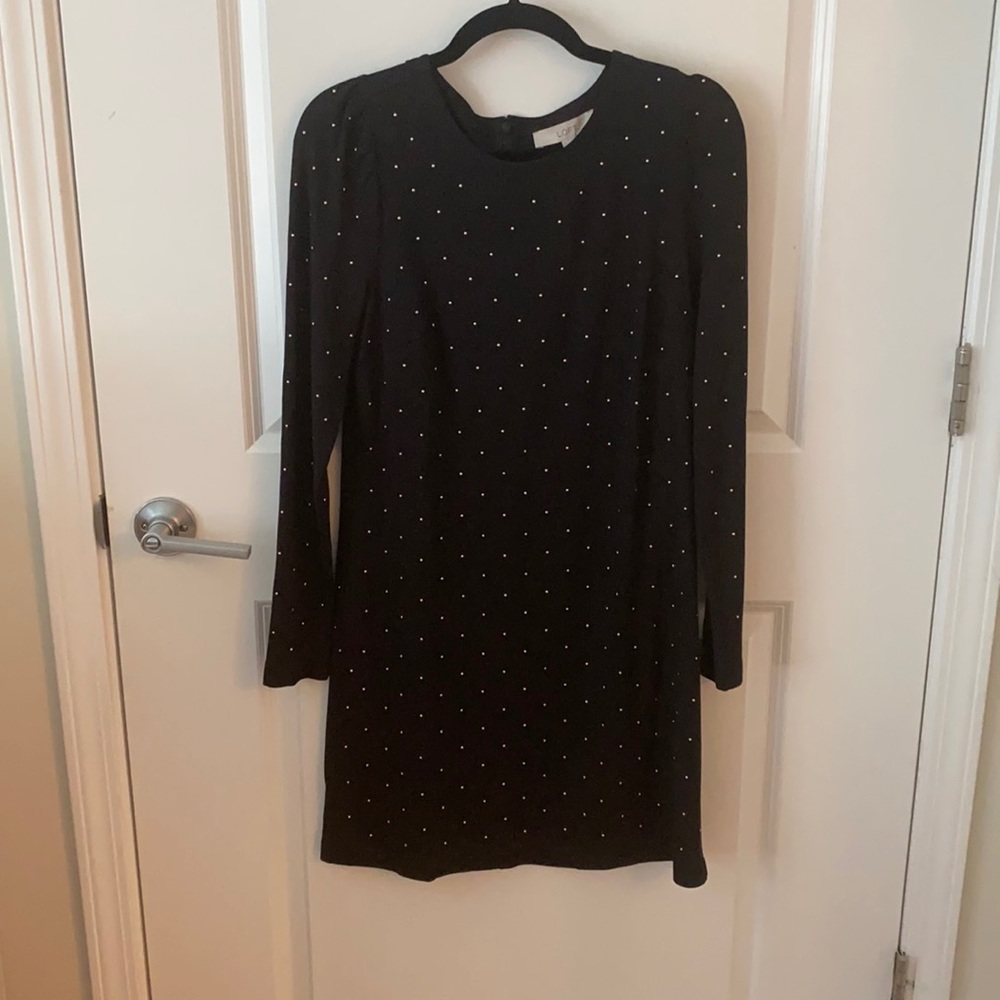 Black mini dress with gold embellishment